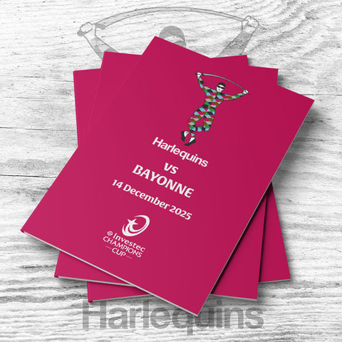 Stack of pink event tickets with Harlequins vs Bayonne text on a wooden surface